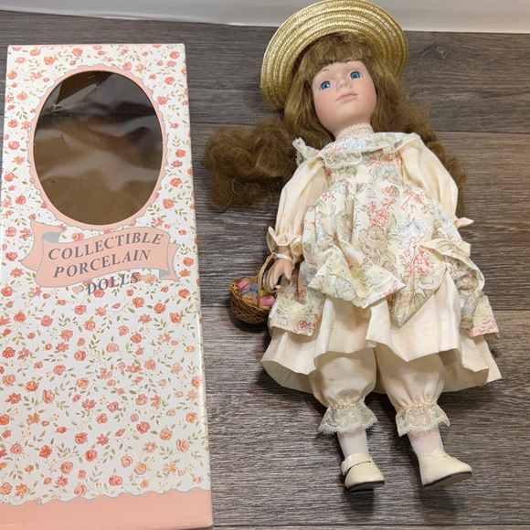 Collectible Porcelain Doll with Floral Dress - Picture 1 of 4